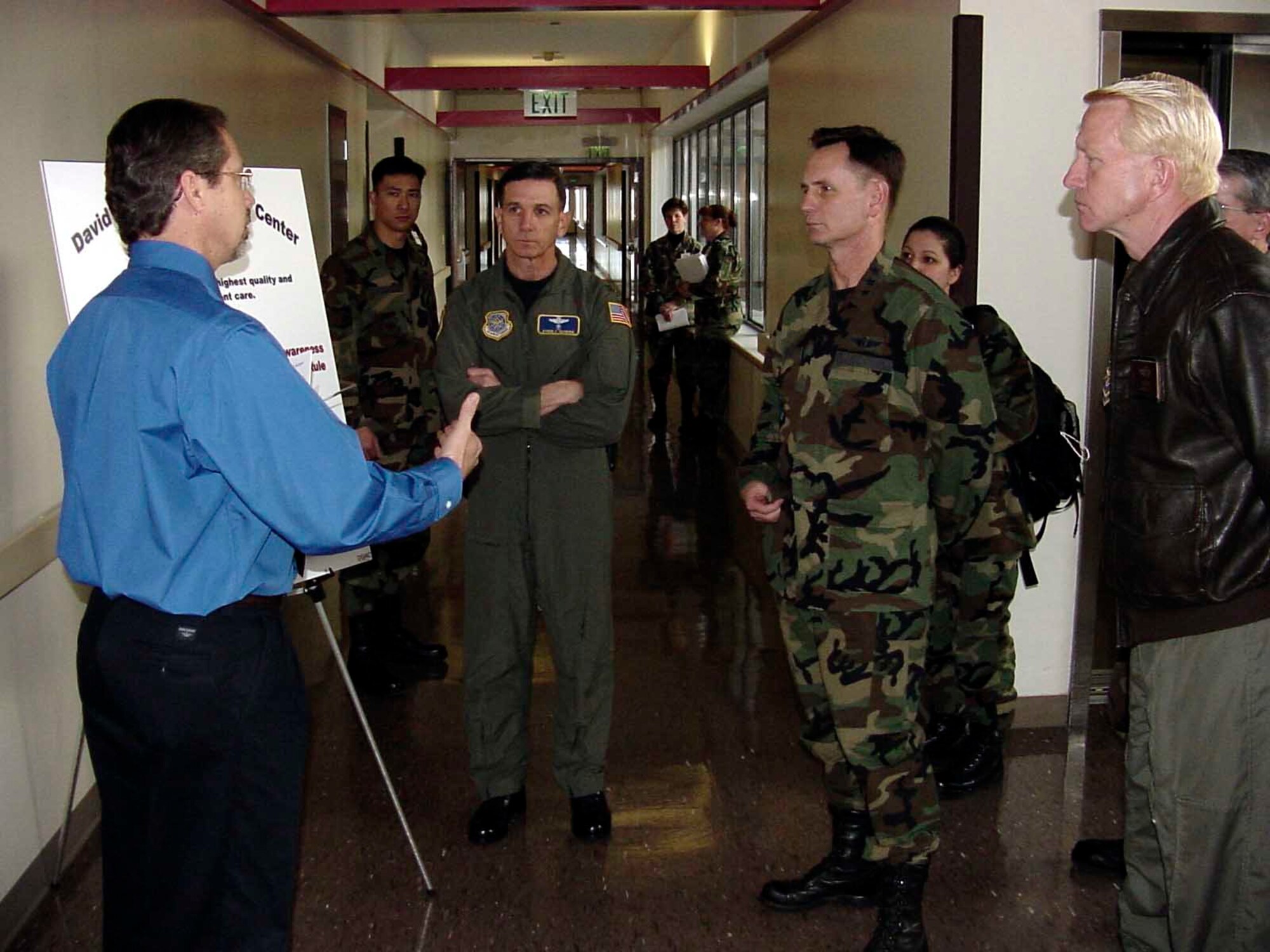 Mr. Peter Gaudet [left], 60th Medical Group patient safety risk management officer, briefs Lt. Gen. George Peach Taylor [middle right], Surgeon General of the Air Force, Brig. Gen. Thomas J. Loftus [right], Air Mobility Command Surgeon, and Col. Byron Hepburn [middle left], 60th MDG commander, during a staff visit to the David Grant USAF Medical Center Feb. 8. (U.S. Air Force photo by Jim Spellman)