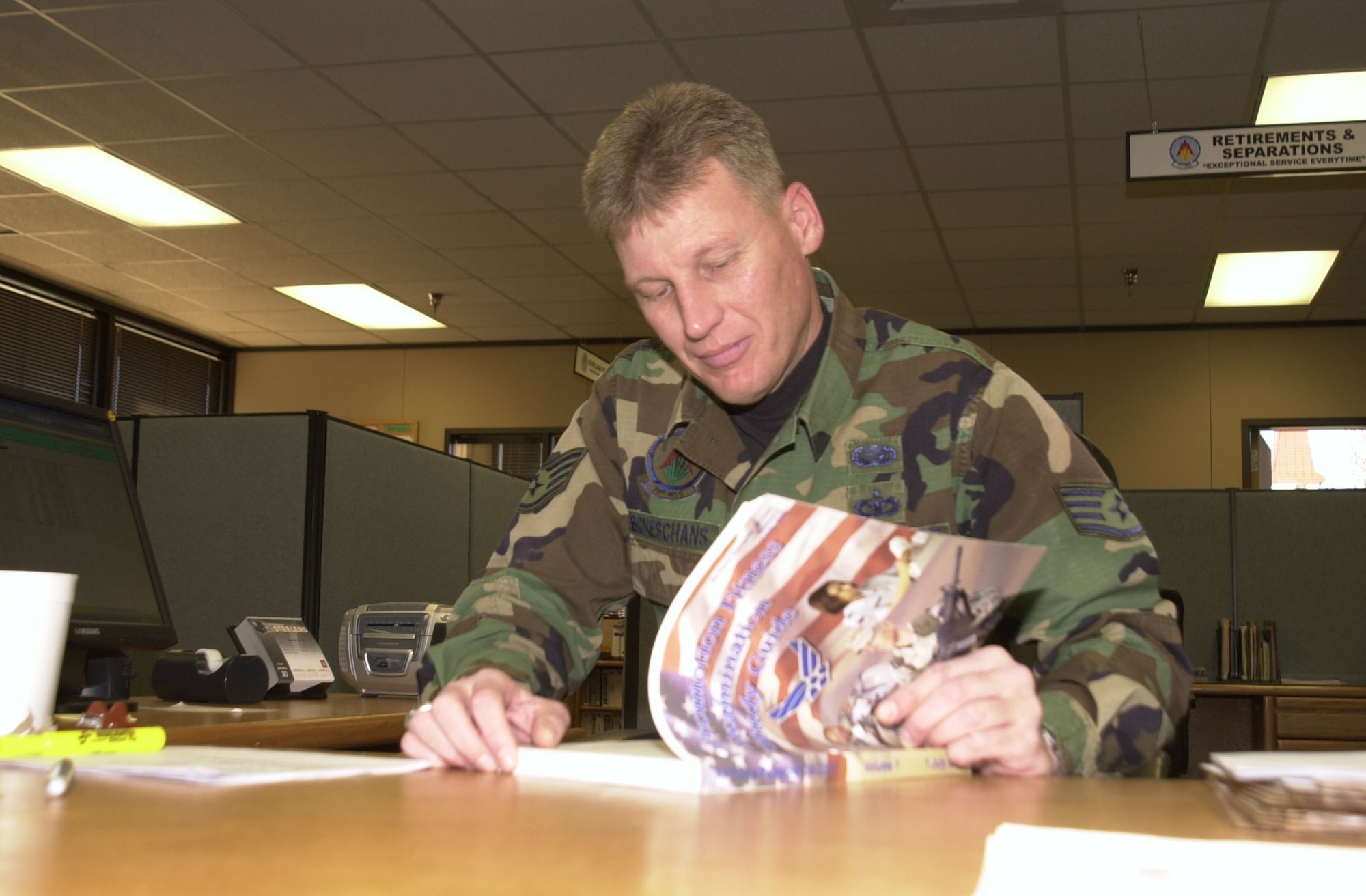 Chief Master Sgt. Brye McMillon, 60th Air Mobility Wing command chief, and Chief Master Sgt. Patricia Thornton, 349th AMW command chief, light the last candle during the chiefs recognition banquet for four active-duty and eight reserve chief master sergeant promotees Feb. 3. The candles represent each of the enlisted ranks, starting from airman basic at the bottom to chief master sergeant at the top. (U.S. Air Force photo by Nan Wylie)