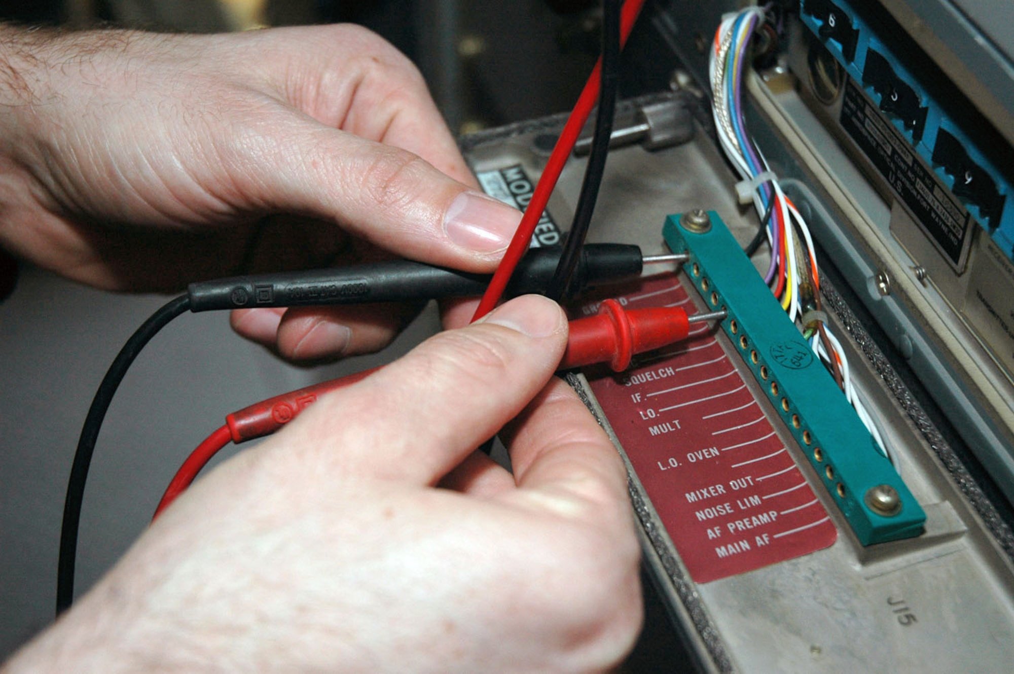 TUZLA AIR BASE, Bosnia and Herzegovina (AFPN) -- Staff Sgt. Mark Beecroft gets a voltage reading on a receiver while performing an annual certification on air traffic control and landing systems. He is assigned to the 401st Air Expeditionary Wing. (U.S. Air Force photo by Master Sgt. Chance Babin)