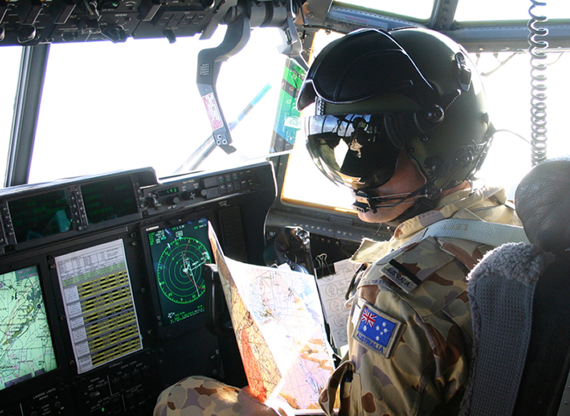 ALI BASE, Iraq (AFPN) -- Flag Officer Damien Boswell is among the Royal Australian Air Force aircrew that fly weekly mercy missions throughout Iraq and Kuwait, gathering injured servicemembers and taking them to higher echelons of care. Officer Boswell is with the 37 Squadron based out of RAAF Base Richmond, New South Wales, Australia. (U.S. Air Force photo by Staff Sgt. Melissa Koskovich)