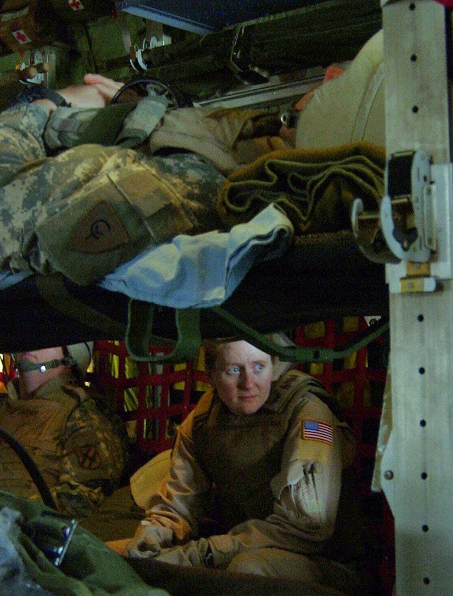 MOSUL, Iraq (AFPN) -- After loading patients, Tech. Sgt. Amy Romanas takes a brief break. "We always hope we won't be busy, but if someone does get hurt, we're ready to give them the care that they need," she said. Sergeant Romanas is a medical technician with the 379th Expeditionary Aeromedical Evacuation Squadron. (U.S. Air Force photo by Staff Sgt. Melissa Koskovich)

