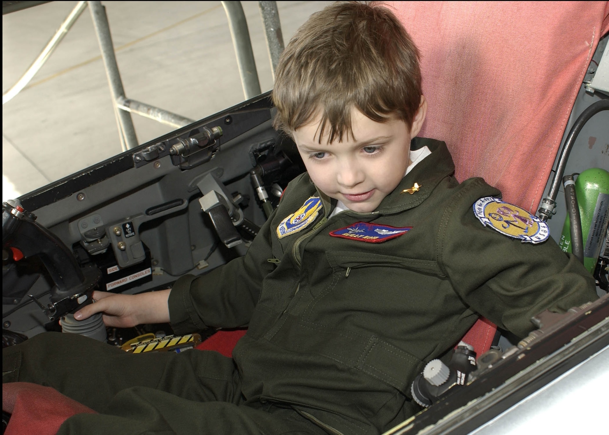 EDWARDS AIR FORCE BASE, Calif. - Reilly Koyl sits in an F-16  Feb. 14 on the support flight line here. His visit to Edwards was made possible by the Edwards Pilot for a Day Program, which gives children with life-threatening illnesses a chance to experience life as a pilot for a day.  (Air Force photo by Mark McCoy)

