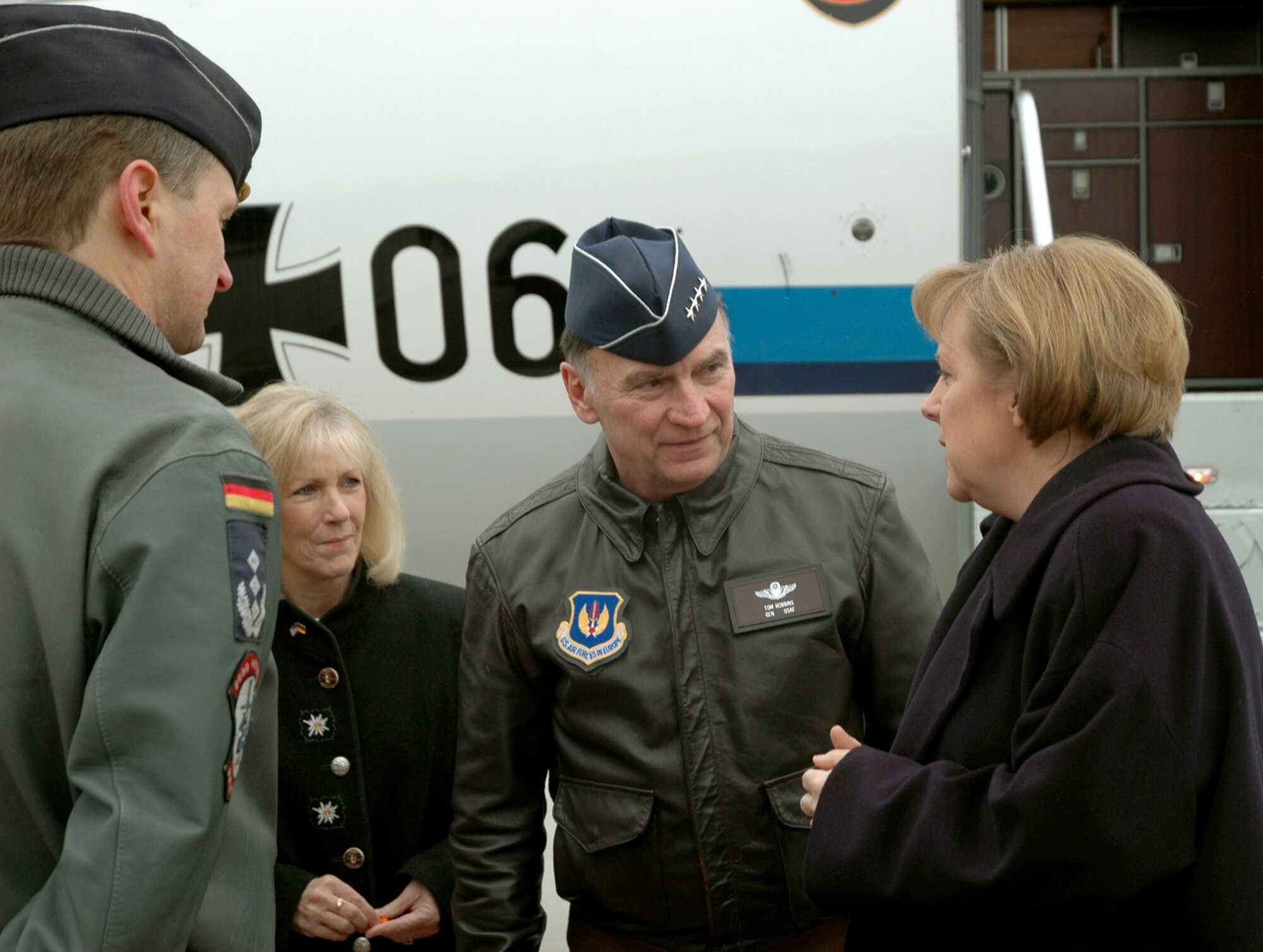 RAMSTEIN AIR BASE, Germany (AFPN) -- Gen. Tom Hobbins, U.S. Air Forces in Europe commander, and his wife, Robbin, and Col. Helmar Storm, Allied Air Component Command Ramstein executive officer, meet German Chancellor Angela Merkel as she transits through the base Feb. 23. (U.S. Air Force photo by 1st Lt. Elizabeth Culbertson)


