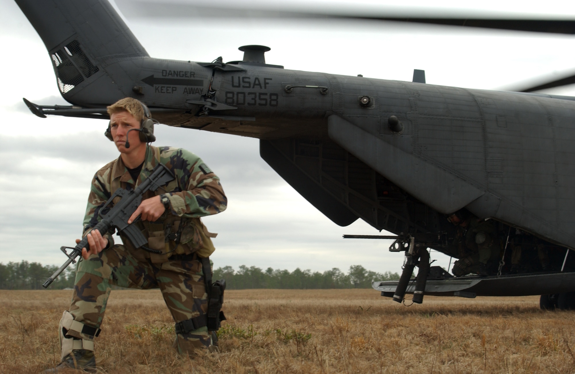 Airman 1st Class Travis Dalton provides security for an MH-53 Pave Low helicopter during an exercise on 22 Feb.  Airman Dalton is a combat controller in the Advanced Skills Training Program at Hurlburt Field, Fla.  The exercise was filmed for the next series of Air Force commercials.  Theme of the commercials will be "Do something amazing."  The film crew also shot footage of AC-130U Spooky gunship, Combat Control Team and MC-130 Combat Talon operations, as well as a Special Tactics High Altitude Low Opening parachute jump during their visit to Hurlburt.
