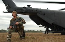 Airman 1st Class Travis Dalton provides security for an MH-53 Pave Low helicopter during an exercise on 22 Feb.  Airman Dalton is a combat controller in the Advanced Skills Training Program at Hurlburt Field, Fla.  The exercise was filmed for the next series of Air Force commercials.  Theme of the commercials will be "Do something amazing."  The film crew also shot footage of AC-130U Spooky gunship, Combat Control Team and MC-130 Combat Talon operations, as well as a Special Tactics High Altitude Low Opening parachute jump during their visit to Hurlburt.
