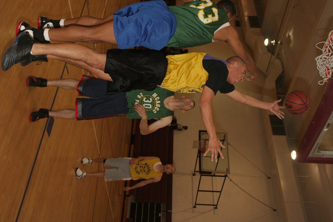 Julian Salazar, Headquarters Battalion Team 1, goes for a layup Monday night in the Commanding General?s Intramural Basketball League.