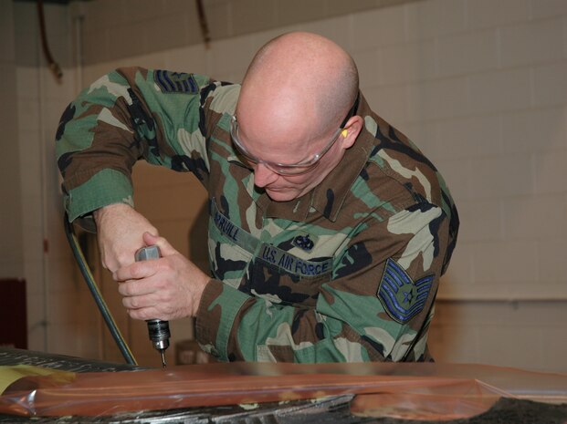 Tech. Sgt. Charles Spruill, a reservist assigned to the 315th Maintenance Squadron, Charleston AFB, S.C., preformas maintenance on a C-17 Globemaster III aileron.  Sergeant Spruill is a traditional reservist performing his required 2-weeks of annual tour. (Photo by Tony Clark, USAFR)