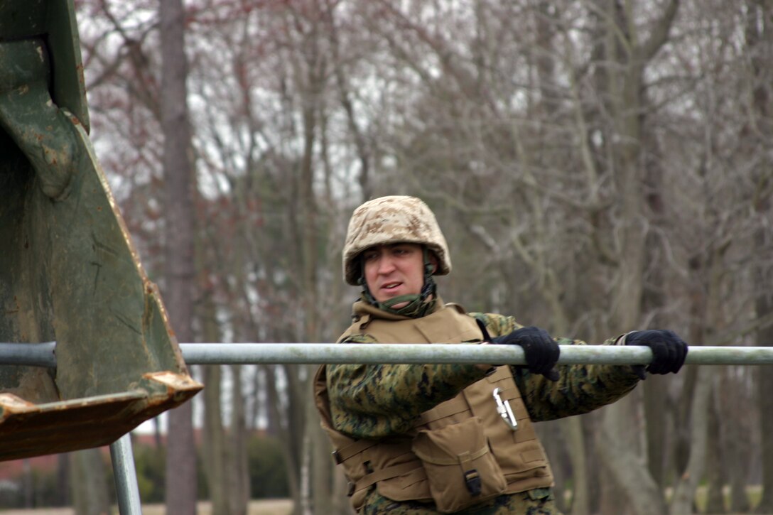 Combat engineers attatched to the 24th Marine Expeditionary Unit, tear down two bridges at Salem Woods Residential Park in Virginia Beach, Va.::n::The Marines are part of the engineer detachment assigned to MEU Service Support Group 24.::n::The 24th MEU is currently conducting its Training in an Urban Environment Exercise.