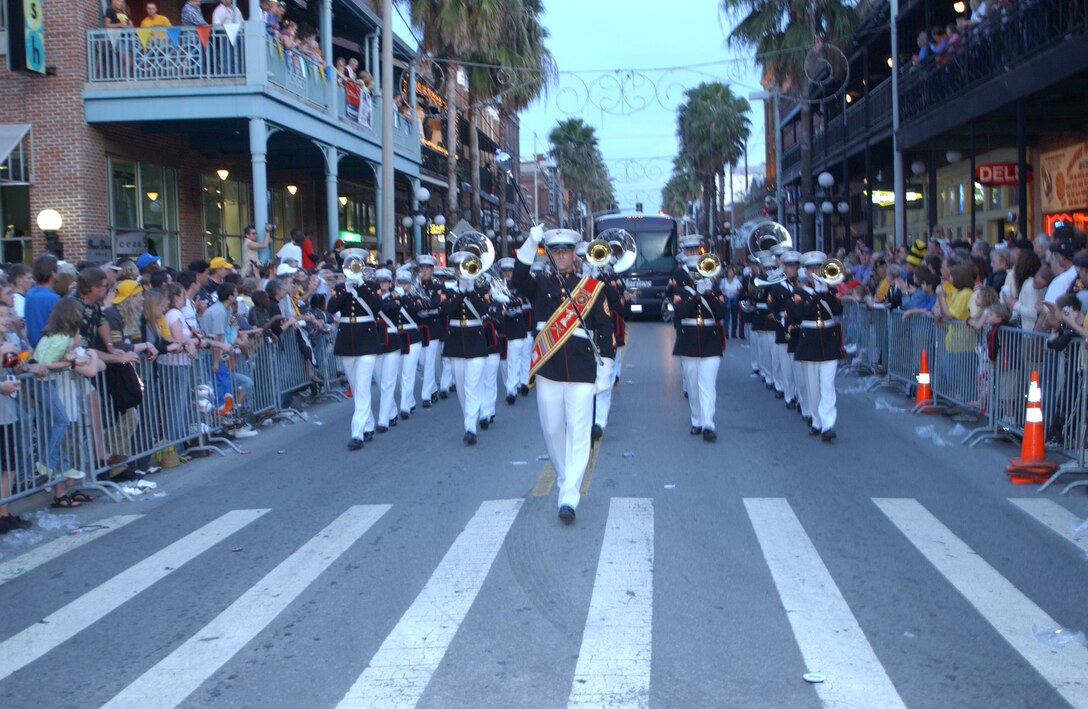 The Parris Island Marine Band looked sharp and played proudly for the crowd gather in Ybor City, Fla., Dec. 31, 2005, in preparation for the 2006 OutBack Bowl. The band gained the admiration of the adoring crowd  with tunes and in sync movements they displayed along the parade's 1.5 mile route.