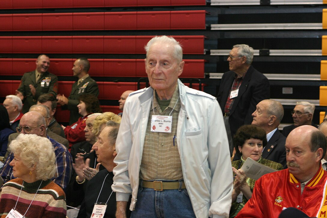 Charles L. Burris, a member of the 2nd Marine Division Association, stands up to be recognized as a former Marine who fought in the World War II theaters of Saipan, Okinawa and Japan.  Members of the 2nd Marine Division Association were on hand Feb. 2-3 to help commemorate the 65th birthday of the "Follow Me" division and pay their respects to fallen warriors past and present.