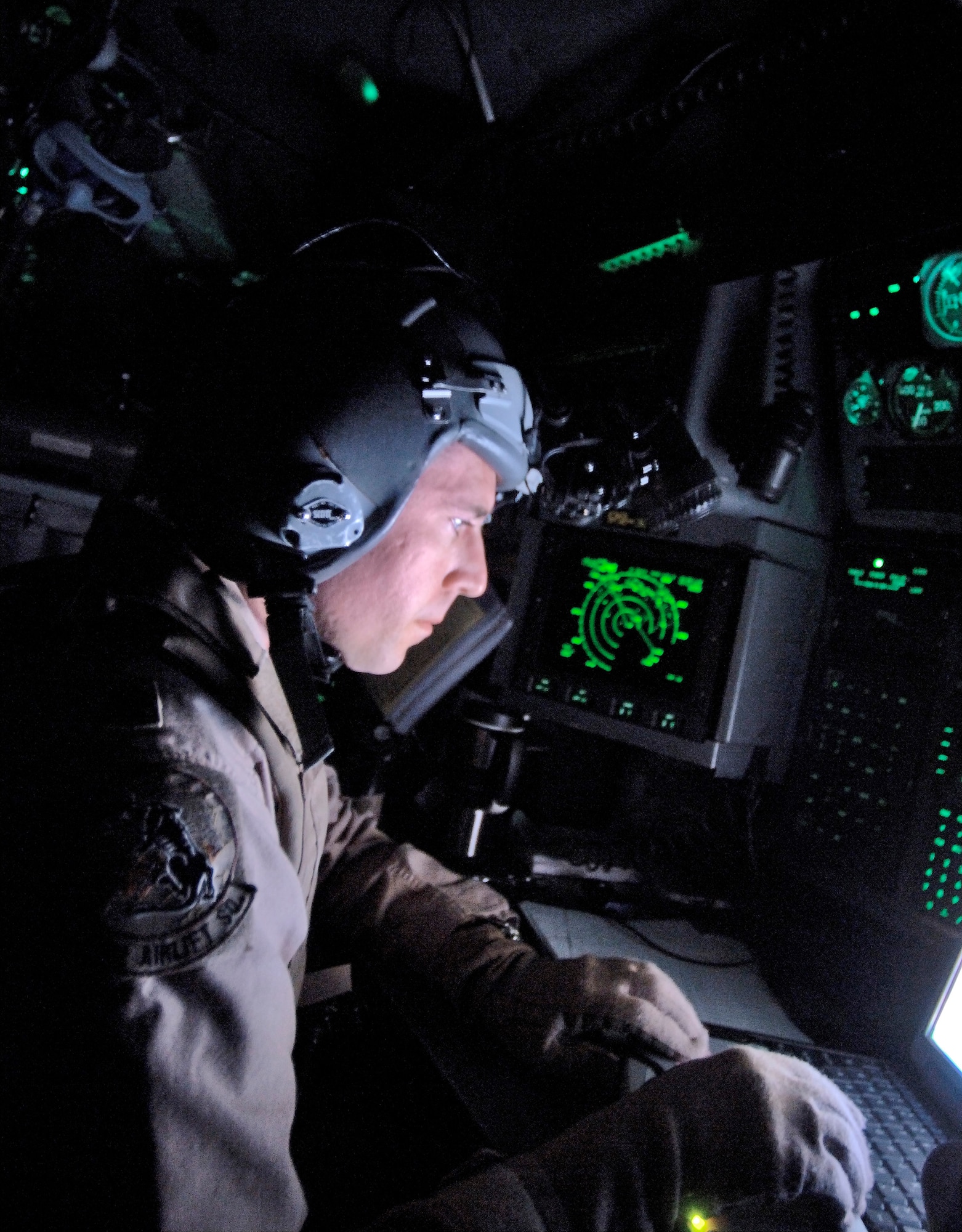 OVER BALAD AIR BASE, Iraq (AFPN) -- Reserve navigator Maj. Eric Heftye keeps his C-130 Hercules on course during a New Year's Eve mission to Balad Air Base. The delivered 13 passengers and 13,000 pounds of cargo -- landing at Balad in 2006. Members of the Air Force Reserve Command's 731st Airlift Squadron, the crew is ending a Southwest Asia tour with the 746th Expeditionary Airlift Squadron. (U.S. Air Force photo by Master Sgt. Lance Cheung)