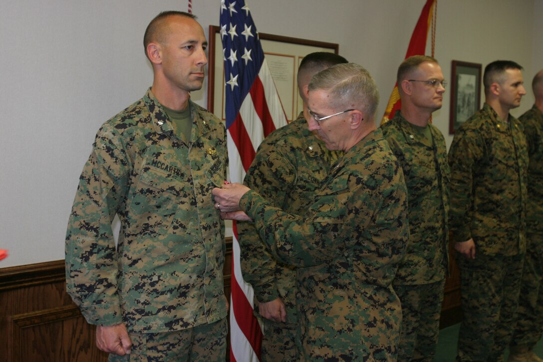 Lt. Col. Christopher McCarthythe staff secretary for Headquarters Battalion, 2nd Marine Division received a Bronze Star for meritorious achievement in Iraq at the II Marine Expeditionary Force headquarters building on April 4. The award was presented by Maj. Gen. Richard A. Huck, commanding general, 2nd Marine Division, with many in attendance for the ceremony. (Photo by Lance Cpl. Zachary W. Lester)