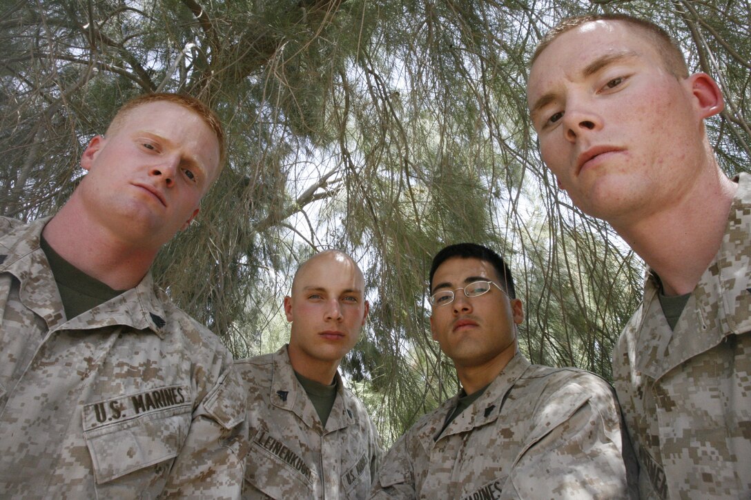 AL ASAD, Iraq - Sgt. Sean P. Carlin and  Cpl.s' Christopher J. Leinenkugel, Steven McMaster and Lance J. Elzner are noncommissioned officers with Combat Logistics Battalion 7 in Al Asad, Iraq. These junior leaders have responsibilities in the battalion's logistics department that affect operations at a higher level. The S4 shop provides ammunition, fuel, food, water, maintenance, and transportation services to the companies to ensure operations in the base are smooth so CLB 7 Marines can continue to support war fighters based at remote forward operating bases as safely as possible.  Picture taken June 4, 2006.
