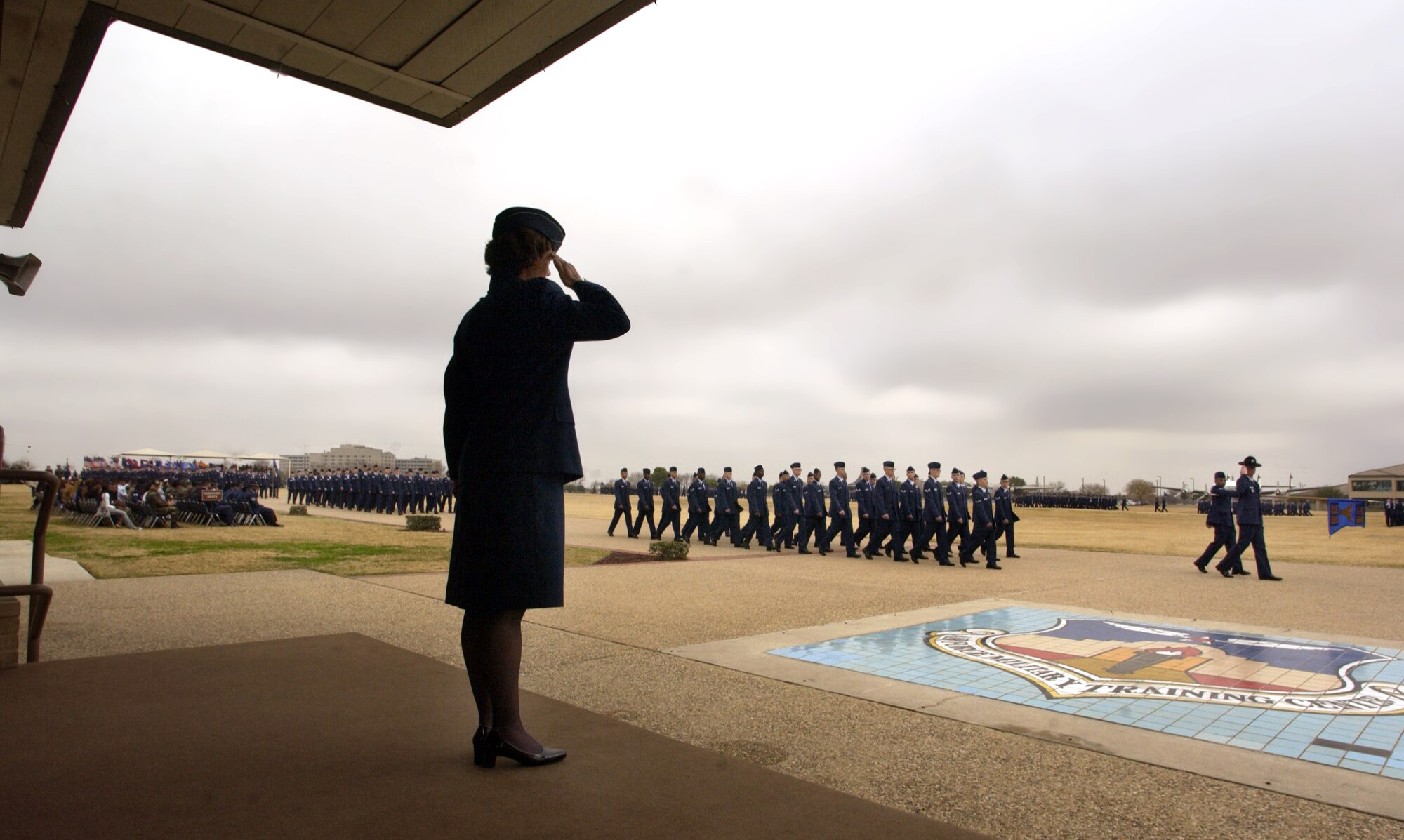 LACKLAND AIR FORCE BASE, Texas (AFPN) -- Col. Gina Grosso reviews 961 of the Air Force's newest Airmen during the last basic military training graduation ceremony for 2005. Each year, nine squadrons work together to train 45,000 active duty, Air National Guard and Air Force Reserve recruits here. Colonel Grosso is the 737th Training Group commander. (U.S. Air Force photo by Master Sgt. Scott Wagers)