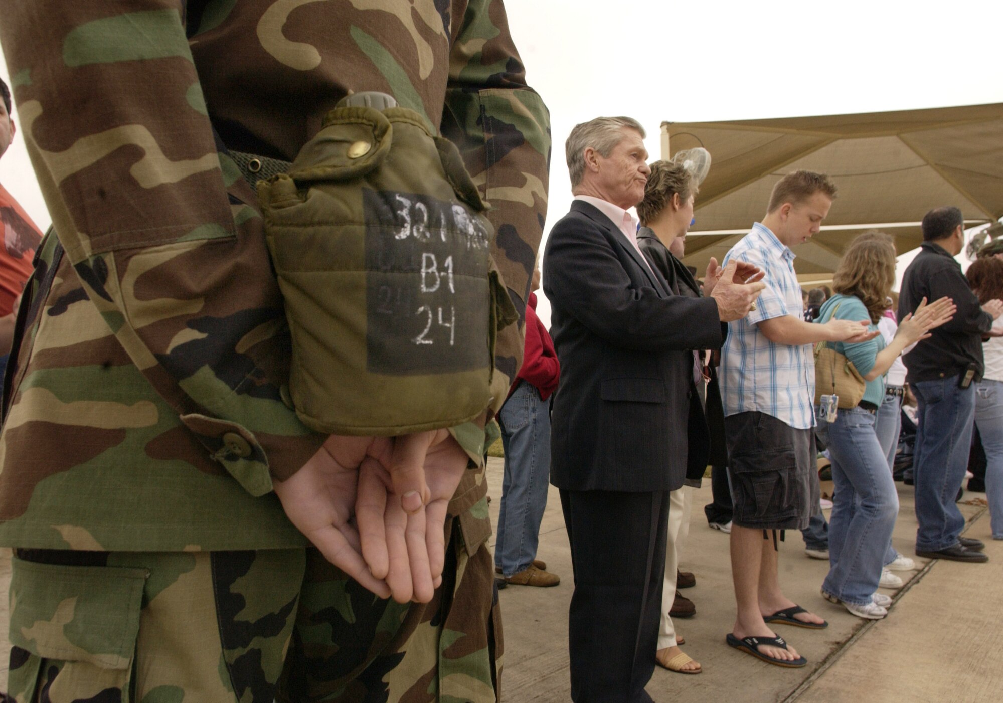 LACKLAND AIR FORCE BASE, Texas (AFPN) -- Basic Trainee Adam Cohn helps control the audience of family and friends who witnessed the graduation of  961 of the Air Force's newest Airmen at the final basic military training graduation of 2005. Trainee Cohn is from Albany, N. Y., and in his third week of training. (U.S. Air Force photo by Master Sgt. Scott Wagers)
