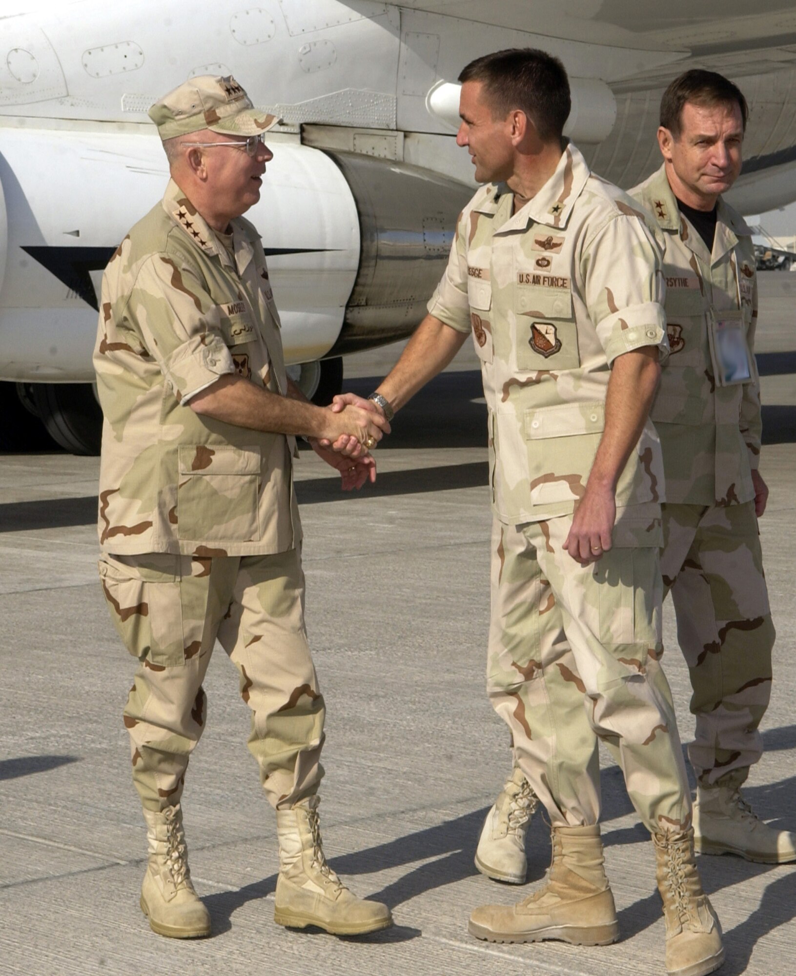 SOUTHWEST ASIA (AFPN) -- Brig. Gen. Ted Kresge welcomes Chief of Staff of the Air Force Gen. T. Michael Moseley to this desert base. The General visited the 379th Air Expeditionary Wing and the combined air operations center. General Kresge is the wing's commander. (U.S. Air Force photo by Staff Sgt. Rhiannon Willard)