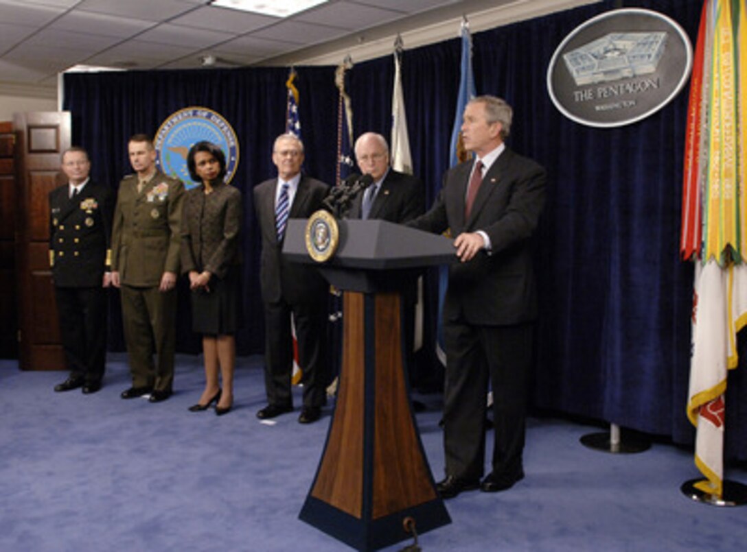President George W. Bush speaks to reporters in the Pentagon after he and members of his national security team were briefed on the latest developments in Iraq, Afghanistan and the global war on terror on Jan. 4, 2006. Vice President Dick Cheney (2nd from right), Secretary of Defense Donald H. Rumsfeld (3rd from right), Secretary of State Condoleezza Rice (4th from right), Chairman of the Joint Chiefs of Staff Gen. Peter Pace (5th from right), U.S. Marine Corps, and Vice Chairman of the Joint Chiefs of Staff Adm. Edmund Giambastiani, U.S. Navy, were briefed by senior commanders in person and via secure video teleconference. 