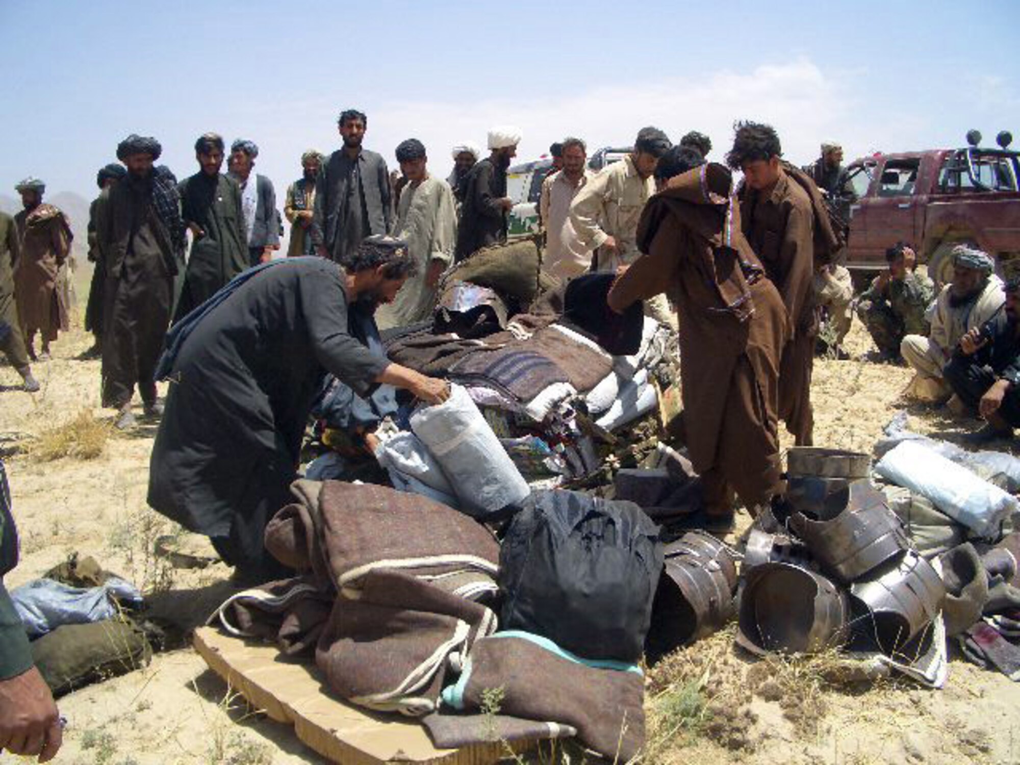 AFGHANISTAN (AFPN) -- The Air Force airdropped 5,400 pounds civic aid near Kandahar, Afghanistan. During 2005, more than 578,000 pounds of civic aid and nearly 1.3 million pounds of troop resupply were airdropped in Afghanistan. (U.S. Air Force photo)