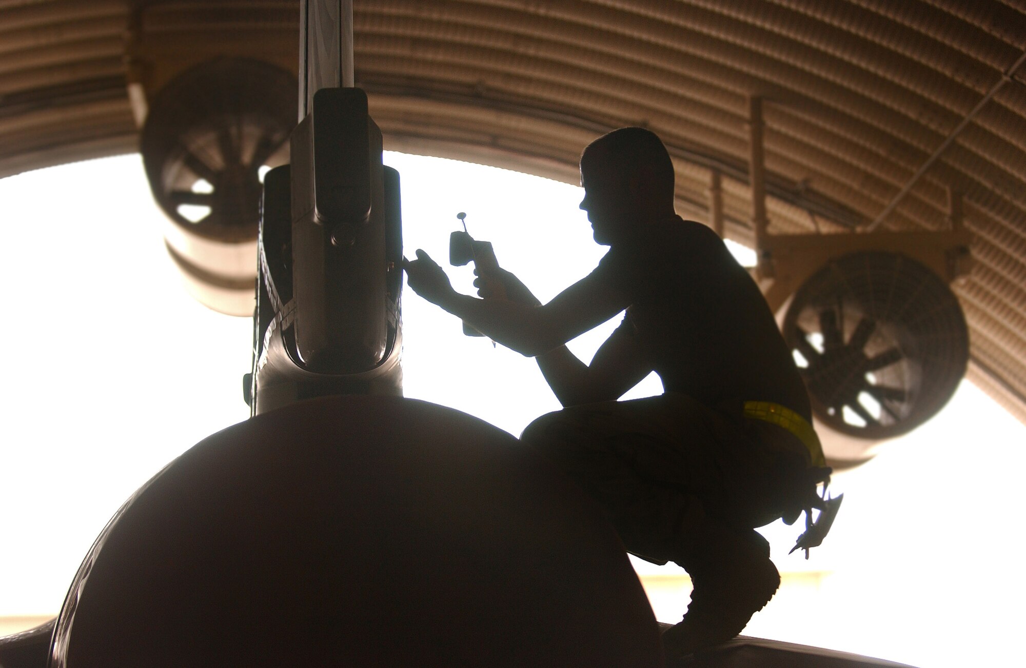 SOUTHWEST ASIA (AFPN) -- An Airman with the 379th Expeditionary Maintenance Squadron inspects a Combined Forces Air Component Command asset, an F-16 Fighting Falcon, in July. During 2005, CFACC assets flew more than 13,000 close-air-support sorties. (U.S. Air Force photo by Airman 1st Class Desiree Hayden)