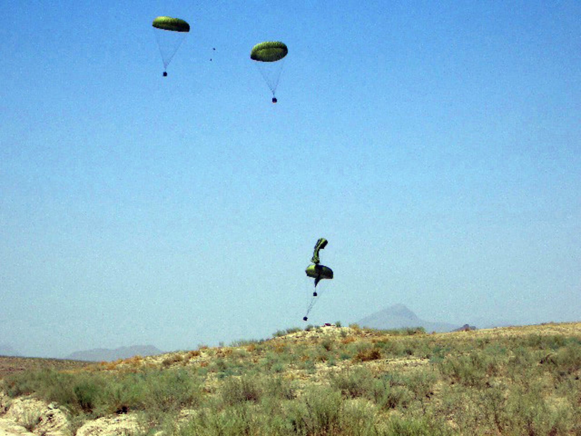 AFGHANISTAN (AFPN) -- The Air Force airdropped 5,400 pounds civic aid near Kandahar, Afghanistan. During 2005, more than 578,000 pounds of civic aid and nearly 1.3 million pounds of troop resupply were airdropped in Afghanistan. (U.S. Air Force photo)