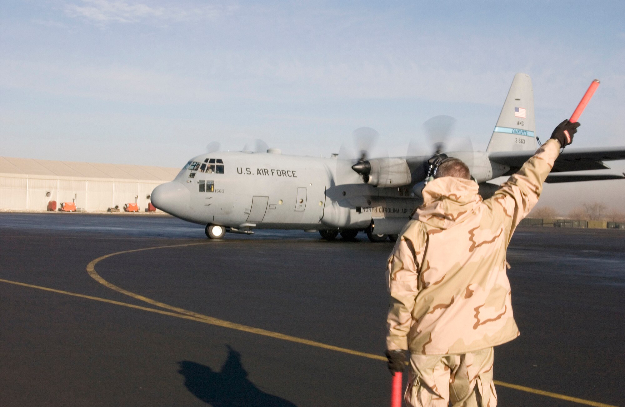 MANAS AIR BASE, Kyrgyzstan (AFPN) -- The last C-130 Hercules assigned here taxis on the ramp before taking off for its new home at Bagram Air Base, Afghanistan. The aircraft is part of the North Carolina Air National Guard's 774th Airlift Squadron. (U.S. Air Force photo by Jim Westfall)