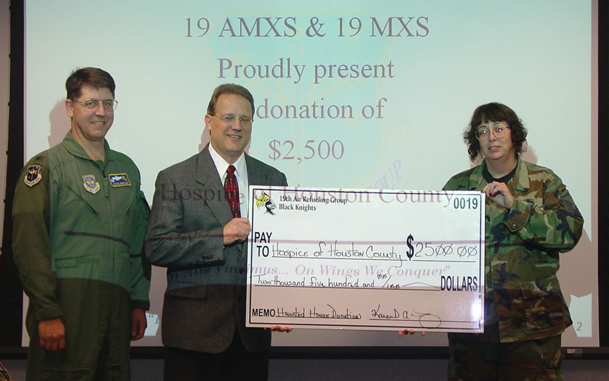 ROBINS AIR FORCE BASE, Ga. (AMCNS) -- The 19th Aircraft Maintenance and 19th Maintenance Squadrons assigned to the 19th Air Refueling Group, an AMC tenant unit at Robins AFB, Ga., recently donated $2,500 to the Hospice of Houston County and $1,500 to the American Legion in Warner Robins Georgia. The money was raised from the proceeds of the annual Haunted House, a fundraiser the Group has run for the past 10 years to raise money for unit morale events. In an effort to give back to the community, the Group chooses a beneficiary each year to which they donate money.
