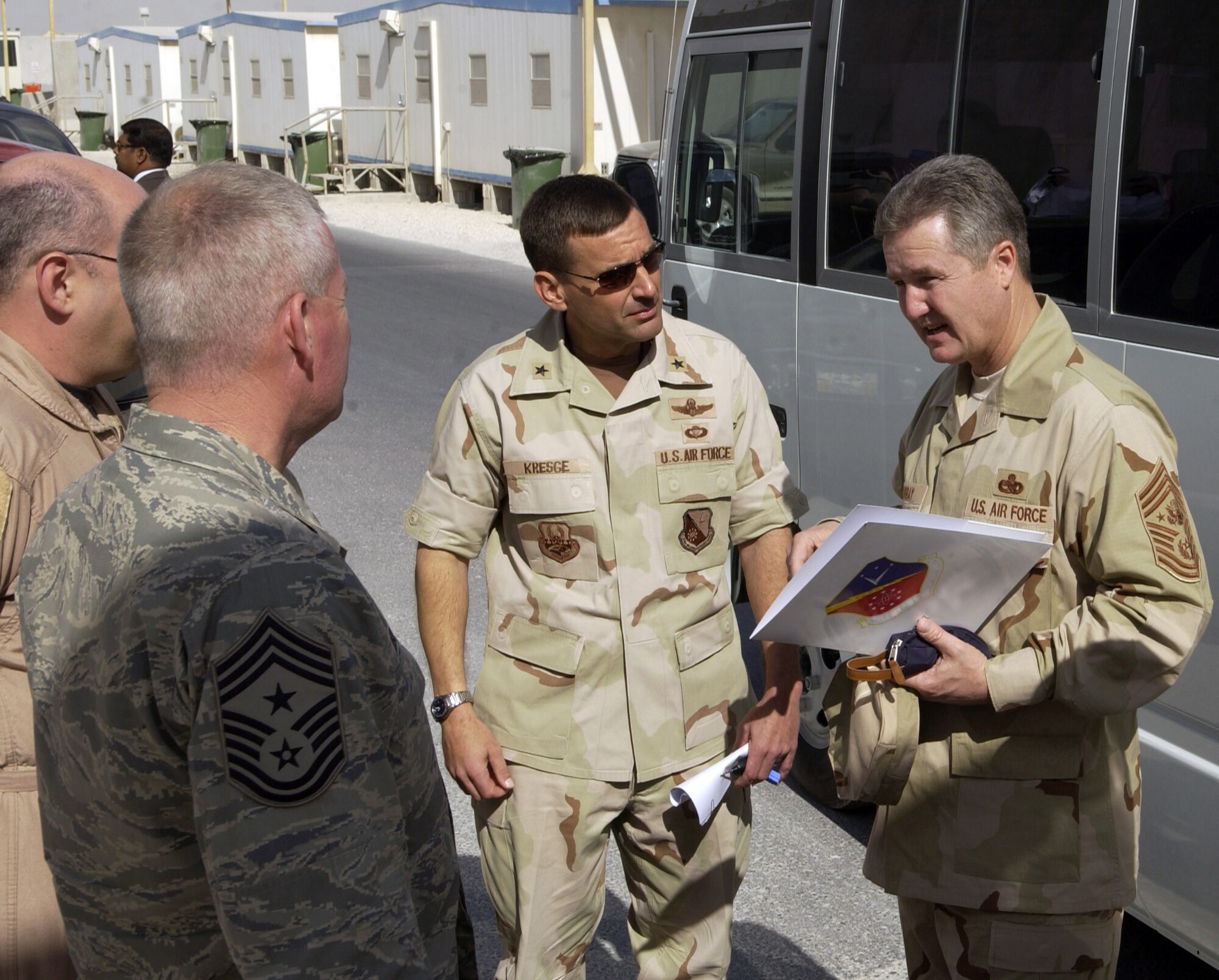 SOUTHWEST ASIA (AFPN) -- Chief Master Sgt. of the Air Force Gerald R. Murray talks to Brig. Gen. Stanley T. Kresge and other senior leaders during his visit to this desert base. General Kresge is the 379th Air Expeditionary Wing commander. (U.S. Air Force photo by Staff Sgt. Rhiannon Willard)