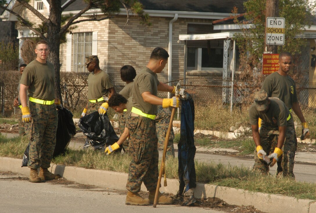 Marines from the Marine Forces Reserve logistics section help clean-up the Lower 9th Ward May 5. Logistics picked up the most trash and covered the most ground in the overall cleanup effort of MarForRes.