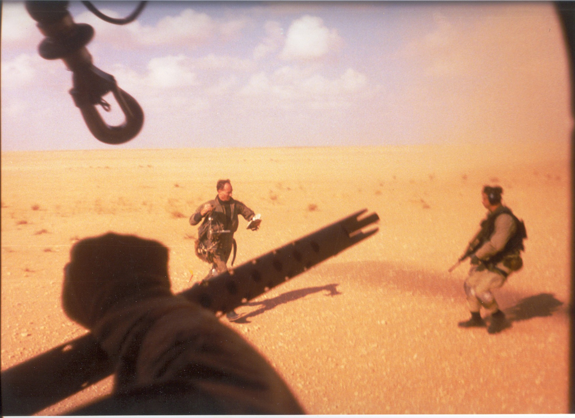 Navy Lt. Devon Jones, left, runs towards the PAVE LOW that rescued him during Operation Desert Storm. The 20th SOS conducted the first combat search and rescue since the Vietnam War. 
