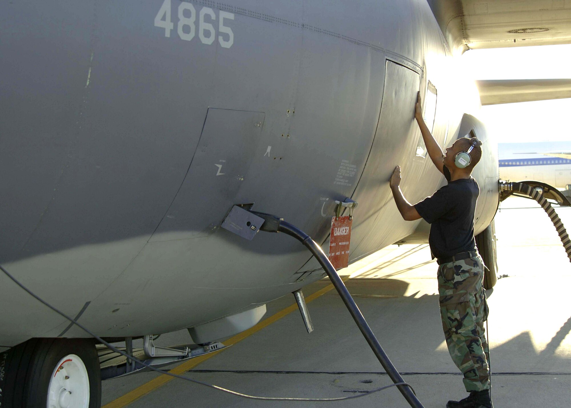 DAVIS-MONTHAN AIR FORCE BASE, Ariz. (AFPN) -- Airman 1st Class Michael Boylan checks for pressurization leaks on the entry door of a HC-130P during a maintenance inspection. Airman Boylan is an electro-environmental apprentice with the 563rd Maintenance Squadron. (U.S. Air Force photo by Airman 1st Class Christina D. Ponte)