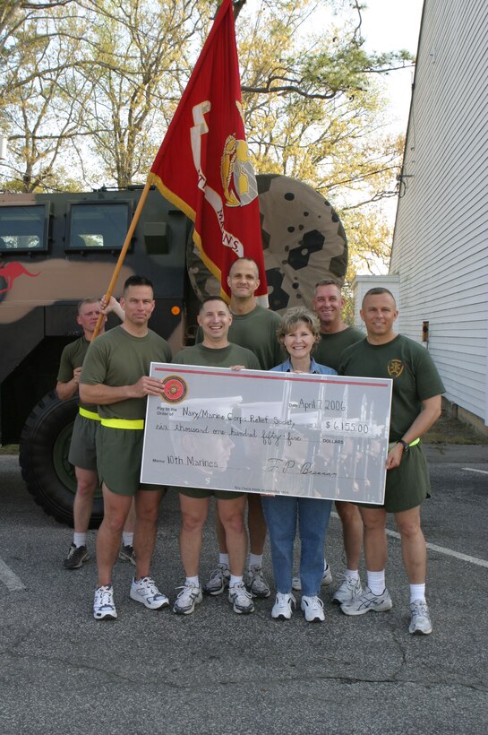 MARINE CORPS BASE CAMP LEJEUNE, N.C. (April 7, 2006)- Marines with 10th Marine Regiment present the Navy-Marine Corps Relief Society with a check for over $6,000 after a three?mile run here. Over 1,300 Marines from the regiment participated. The artillery unit has been deployed to both Operation Iraqi Freedom and Operation Enduring Freedom and many Marines and sailors in the regiment had been helped by the society.