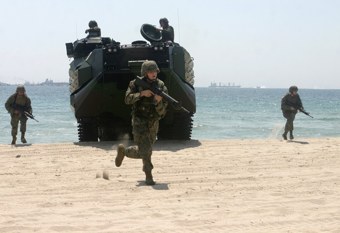 FORT LAUDERDALE, Fla. - "The Marines have landed!" should have been the phrase of the day here May 6 as the troops of 2nd Assault Amphibian Battalion, 2nd Marine Division, rushed out of their Assault Amphibian Vehicles onto the sunny Florida coastline to simulate seizing an enemy beachhead.  The Marine demonstration was one event to take place during the McDonald's Air and Sea Show, a two-day military exposition in which each branch of service showcased their vehicles, personnel and capabilities before millions of civilians and tourists in the area.