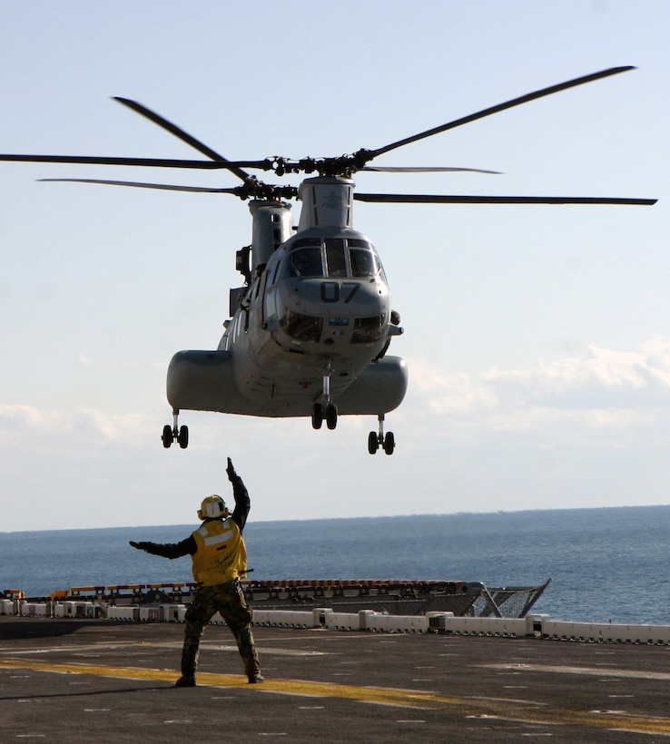 A CH-46E Sea Knight helicopter attached to Marine Medium Helicopter Squadron 365 practices at-sea landings aboard USS Iwo Jima.  HMM-365 pilots are completing their required shipboard qualifications while participating in the Group Sail exercise.::n::HMM-365 is the Aviation Combat Element of the 24th Marine Expeditionary Unit.  The 24th MEU is scheduled to deploy in the spring with the seven vessels of the Iwo Jima Expeditionary Strike Group. The Marines’ mission and destination have yet to be determined.::n::