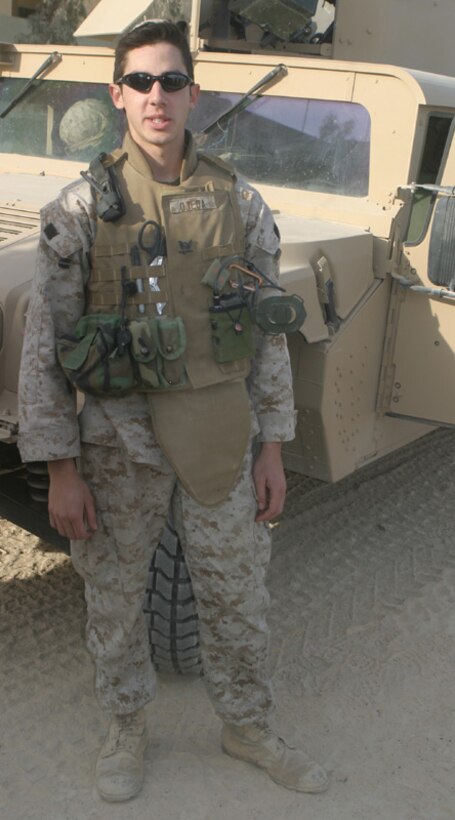 Petty Officer 3rd Class William Ojeda, the platoon corpsman for the Regimental Combat Team-2 Jump Team, stands in front of the Humvee from which he began lifesaving measures on two Marines critically wounded in an improvised explosive device blast. Ojeda, a Miami, Fla., native, has been in the Navy for five years, joining at the age of 16. The Jump Team is responsible for security for 2nd Marine Regiment commander Col. Stephen W. Davis.