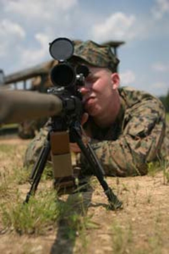 Lance Corporal William L. Reed, Battalion Landing Team, 2nd Bn., 2nd Marine Regiment, demonstrates sighting the MK-11, the 26th MEU Scout Snipers' new sniper rifle.  The unit was firing the weapon for the first time on the range at Fort A.P. Hill, Va.