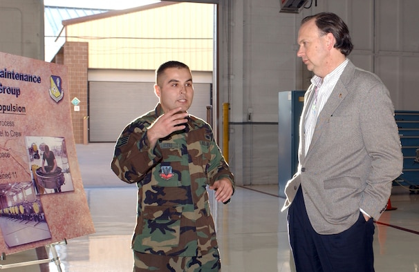 CANNON AIR FORCE BASE, N.M. (AFPN) -- Staff Sgt. Andrew Lucero, from the 27th Component Maintenance Squadron, briefs Assistant Secretary of the Air Force William C. "Bill" Anderson about improvements to the Propulsion Maintenance Flight's work center to include reorganizing personnel work space and a $200,000 floor repainting project during Mr. Anderson's visit, Jan. 4 to Cannon Air Force Base, N.M. (U.S. Air Force photo by Airman 1st Class Heather R. Salazar)