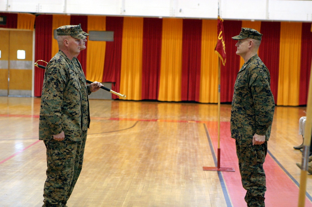 MARINE CORPS BASE CAMP LEJEUNE, N.C. -- Both Sergeants Major, Bruce J. Poland and Robert R. Terry stood in front of Col. George P. Garrett as they were preparing to pass the NCO sword, signifying the change of responsibility from one to the other.  Photo by Cpl. Athanasios L. Genos