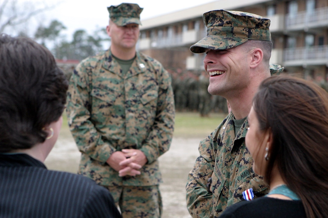 MARINE CORPS BASE CAMP LEJEUNE, N.C. - Laughing with his friends and family, 1st Lt. Brian M. Stann, Weapons Company Commander, 3rd Battalion, 2nd Marines shook hands with many as they congratulated him on a job well done. Stann was being recognized and honored in front of the battalion for a job well done when he went above and beyond the call of duty to keep his men alive and eliminate the enemy forces along the way during Operation Matador.  Photo by Cpl. Athanasios L. Genos