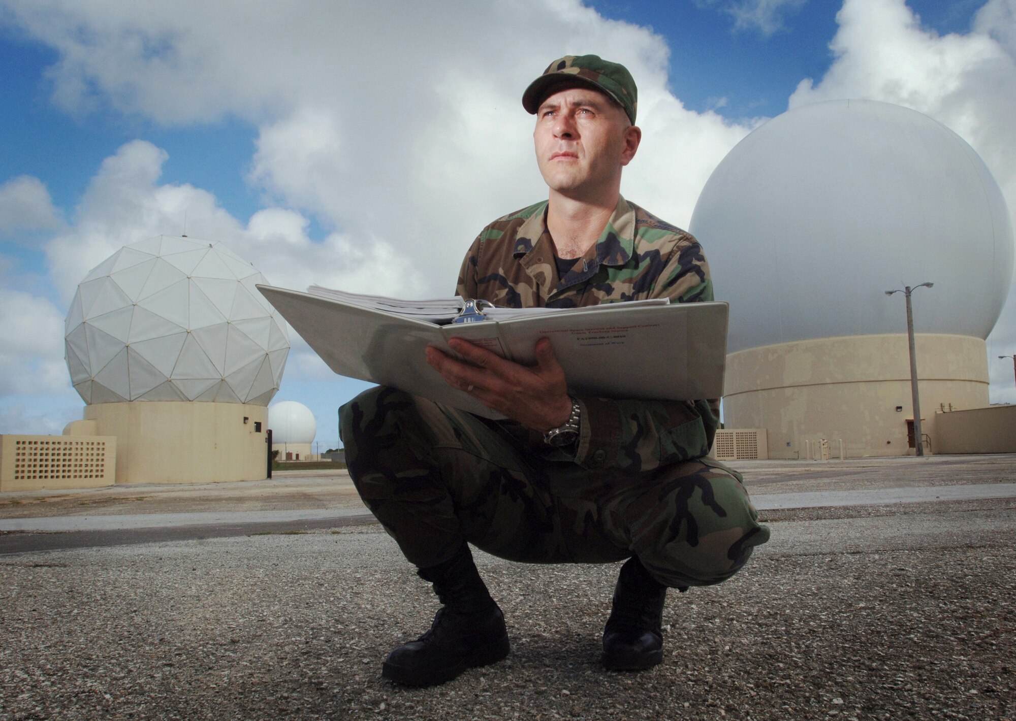ANDERSEN AIR FORCE BASE, Guam (AFPN) -- Tech. Sgt. Greg Butikofer references his technical order during an inspection of radome antennas at his facility. Sergeant Butikofer is a quality assurance evaluator with the Detachment 5, 22nd Space Operations Squadron here. Their mission is to execute on demand, real-time, command and control operations for launch and operations of 170 Department of Defense, national, allied and civilian satellites. (U.S. Air Force photo by Master Sgt. Val Gempis)