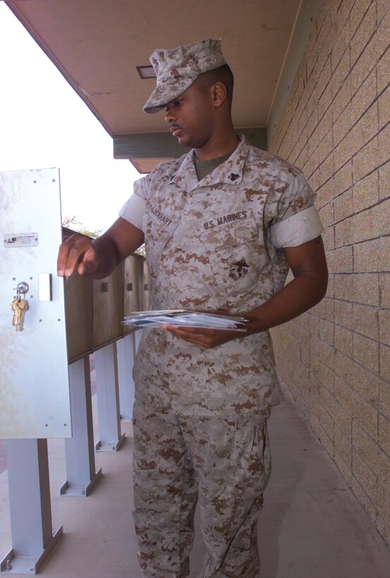 Cpl. Anthony Lockhart, base postal clerk, fulfills his duties by delivering mail to Marines. Lockhart has found his long-lost father by using the skills and technology the Marine Corps has provided to him.
