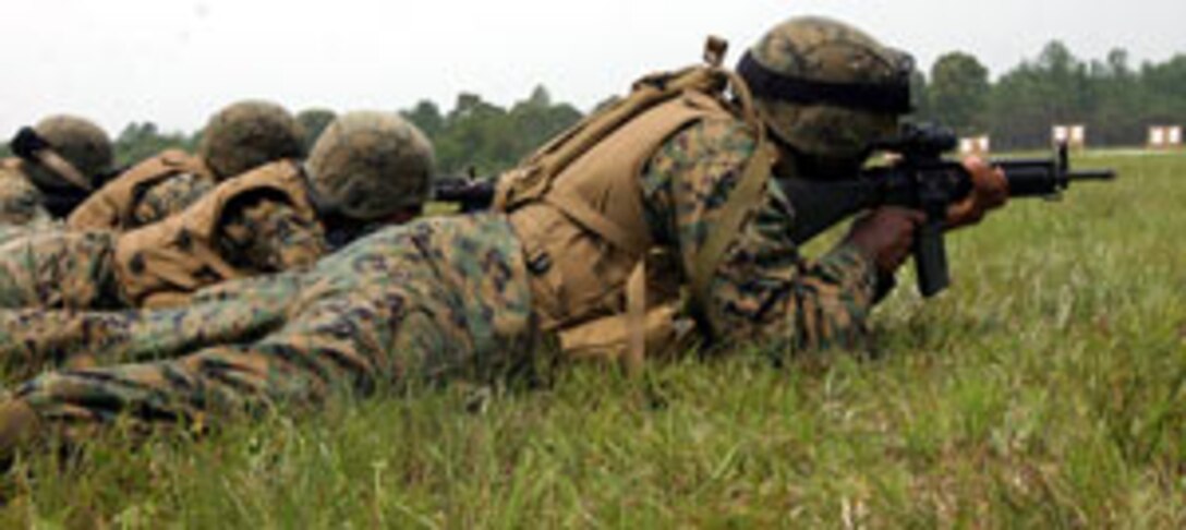 Marines from Combined Anti-Armor Platoon, Weapons Company, Battalion Landing Team 2nd Bn., 2nd Marine Regiment, 26th Marine Expeditionary Unit, attain battle sight zeros for their rifle combat optics during a shoot at a range aboard Fort A.P. Hill, Va., July 11.  The 26th MEU is preparing for a deployment early in 2007.