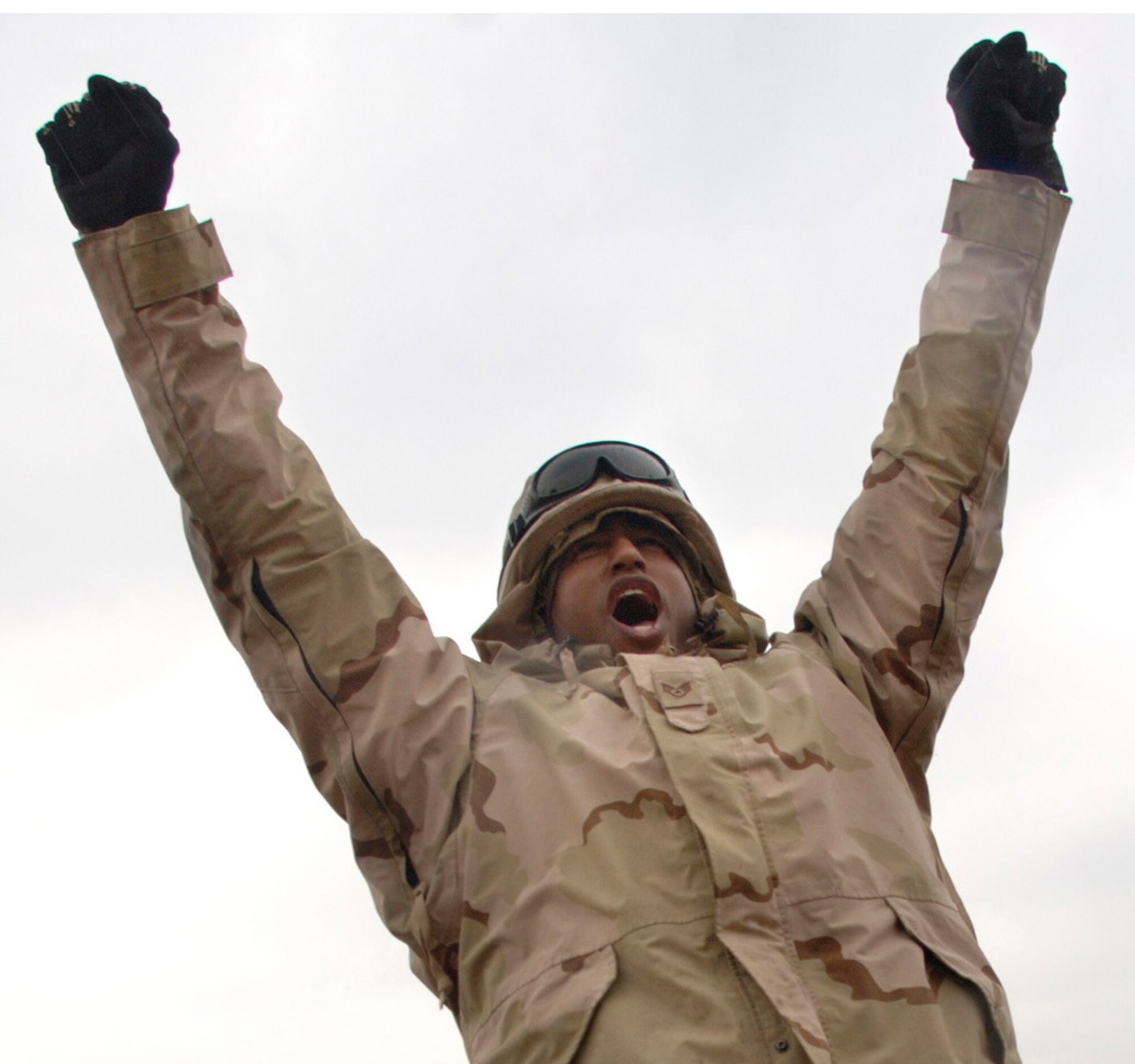 BALAD AIR BASE, Iraq (AFPN) -- Staff Sgt. Viktor Hancock celebrates the completion of a convoy security mission that achieved the unit's 4-million mile mark. As a gunner he operates the roof-mounted 128-pound, 50-caliber M2 machine gun. When called upon he can unleash 450 to 550 rounds per minute at up to 6,764 meters away. Sergeant Hancock is assigned to the 732nd Expeditionary Logistics Readiness Squadron and is deployed from Nellis Air Force Base, Nev. (U.S. Air Force photo by Master Sgt. Lance Cheung)