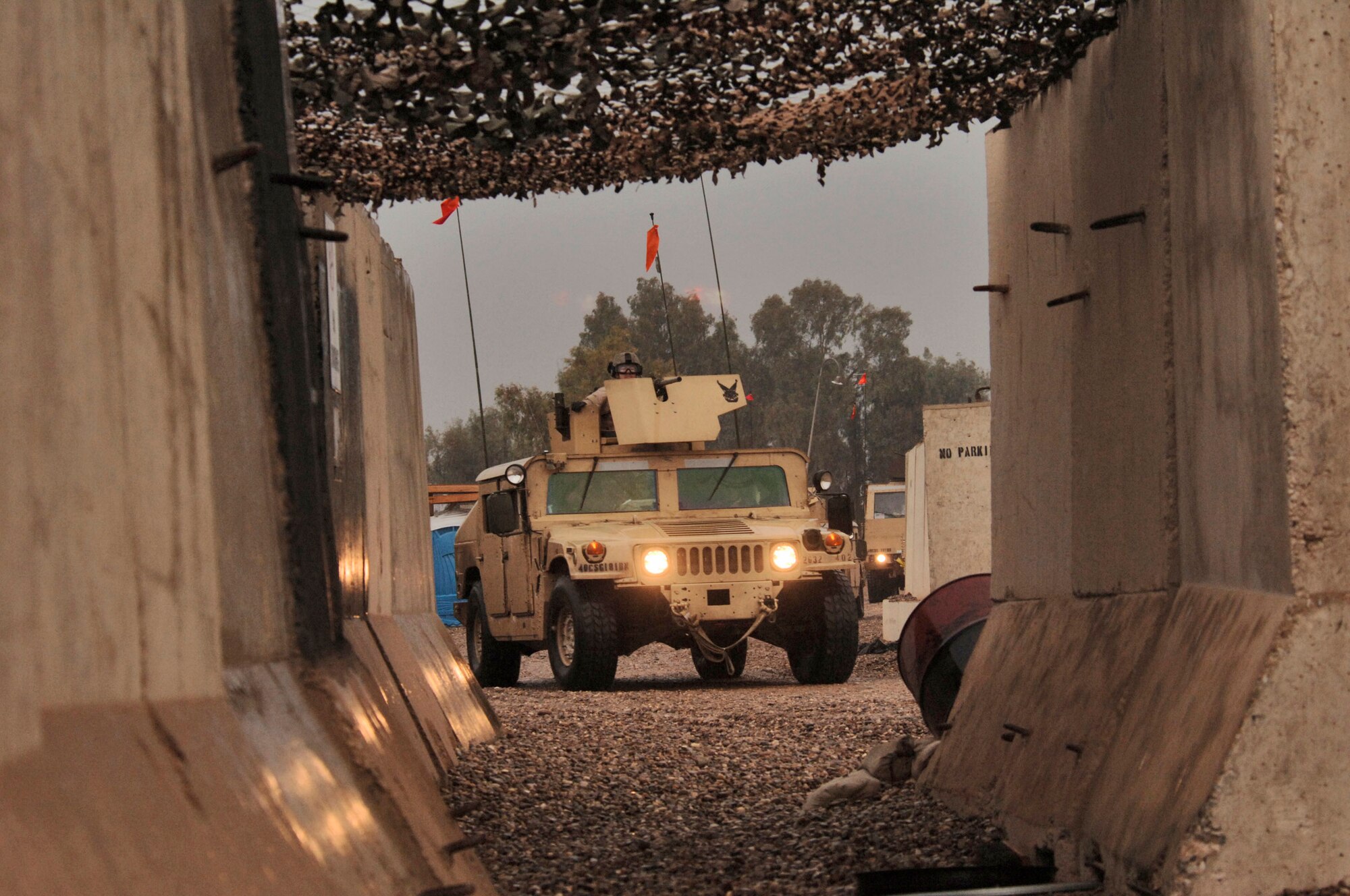 BALAD AIR BASE, Iraq -- M-1114 Humvee vehicles lead a convoy security team from the 732nd Expeditionary Logistics Readiness Squadron as they complete their 4-million mile mark Jan. 7. The team included some Soldiers for training purposes. (U.S. Air Force photo by Master Sgt. Lance Cheung) 
