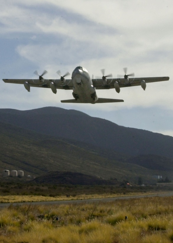 MARINE CORPS BASE HAWAII, KANEOHE BAY (Jan. 11, 2006) -- Over the beautiful Mauna Kea mountain, a KC-130T Hercules charge plane with Marine Aerial Refueler Transport Squadron 234, Marine Aircraft Group 41, takes off in support of a Hawaii Combined Arms Exercise taking place this month in Pohakuloa Training Area, Hawaii. Meaning "white mountain," Mauna Kea is just one of the mountains near PTA where the Marines will train in maneuvers and combat tactics. Based out of the Naval Air Station Joint Reserve Base-Fort Worth, Texas, the 'Rangers' are serving as a force provider to MAG-24 who is operating as the Air Combat Element in the exercise. Other units participating in the exercise include Combat Service Support Group 3 and the 3rd Marine Regiment. (U.S. Marine Corps photo by Sgt. Joel A. Chaverri)