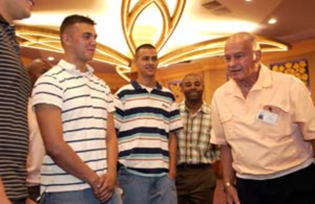 Donn Lewin, a Marine who served during WWII, talks to Marines from 3rd Radio Battalion about his experiences on Iwo Jima before the advanced screening of "Flags of Our Fathers,"  at the Dole Cannery 18 Megaplex, Honolulu,  Oct. 15.