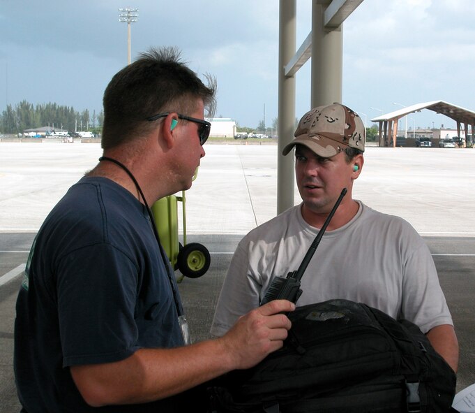 Crew chiefs from the 482nd Fighter Wing discuss preparations for a flyover at Homestead ARB, Fla., on July 4.  Crew chiefs are responsible for making sure aircraft are safe and ready to fly everyday.  Many of the crew chiefs at Homestead ARB have been maintaining the same aircraft for 20 years (U.S. Air Force Reserve photo by Lisa Macias).