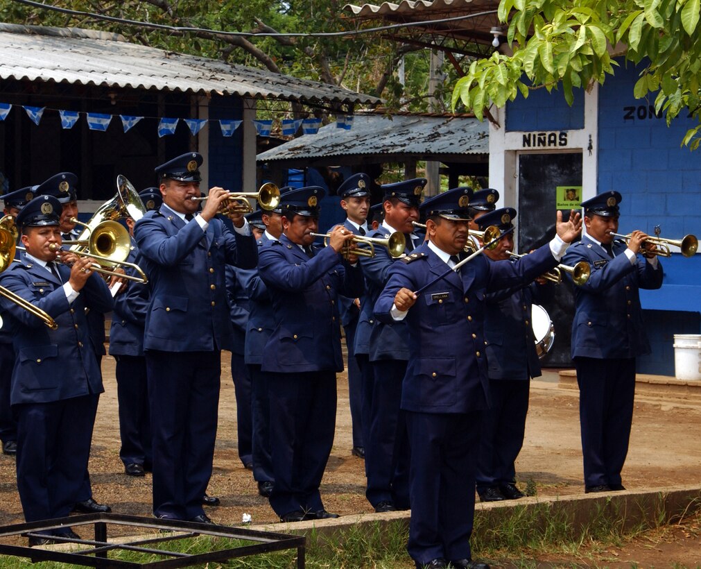 An El Salvadorian military band performs during  the ribbon cutting ceremonies for Operation  Para los Ninos in San Vicente, El Salvador.  The 482d Fighter Wing Civil Engineering Squadron was the lead unit for the humanitarian operation, which saw the construction of two schools and three medical clinics near San Vicente (U.S. Air Force Reserve photo by Lt. Col. Tom Davis). 