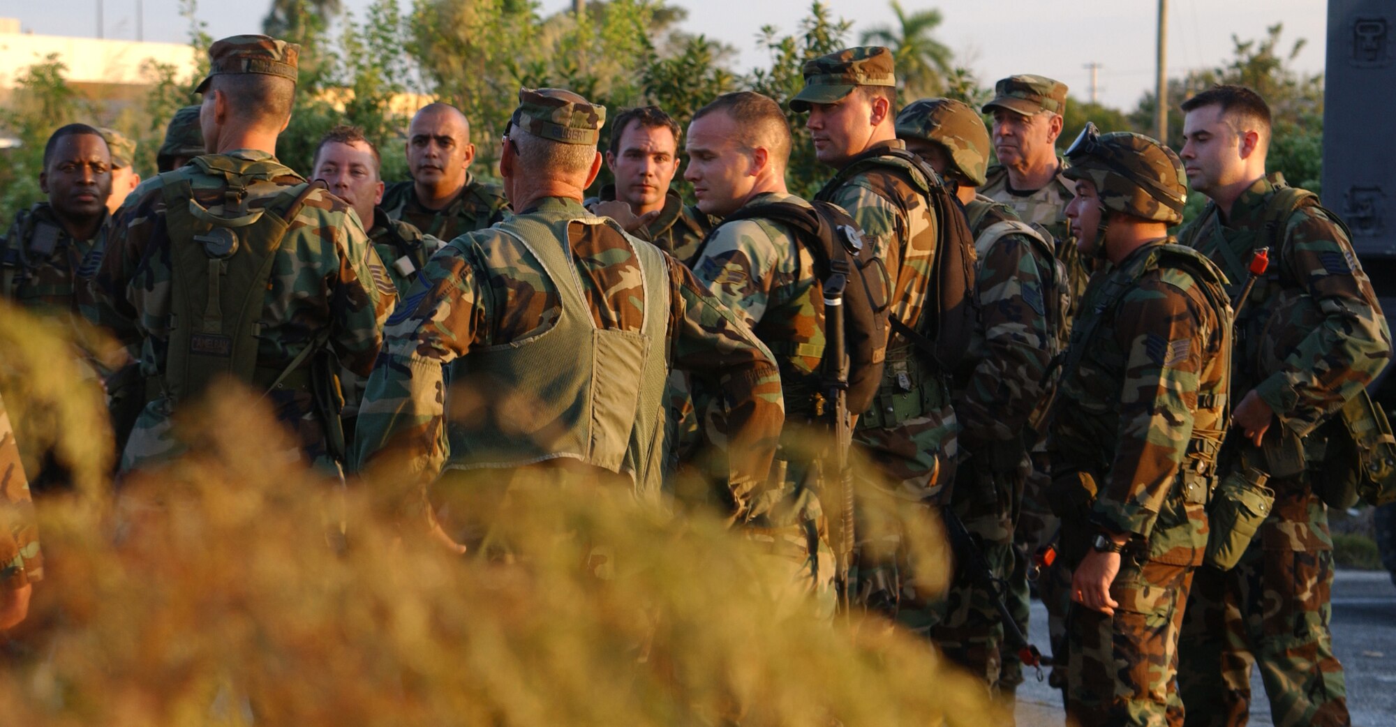 Security Forces personnel debrief at Homestead Air Reserve Base following an intense day of training.  They are preparing for deployment to combat areas. (US Air Force Reserve photo by Jake Shaw)