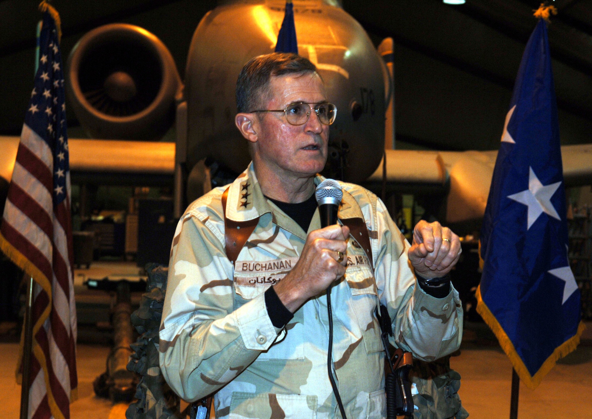 BAGRAM AIR BASE, Afghanistan (AFPN) -- Lt. Gen. Walter E. Buchanan III, U.S. Central Command Air Forces commander, addresses Airmen and Sailors in a hangar here as part of his last trip to Afghanistan as commander. General Buchanan is scheduled to retire this spring. (U.S. Air Force photo by Staff Sgt. Marcus McDonald)