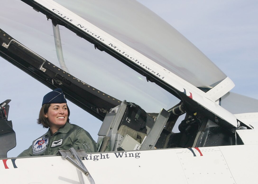 NELLIS AIR FORCE BASE, Nev. -- Capt. Nicole Malachowski sits in the #3 Right Wing Thunderbird jet before a practice. Captain Malachowski was chosen for the position for the 2006 season. Captain Malachowski is the first female Thunderbird pilot to be on the team. (U.S. Air Force photo by Julie Ray)